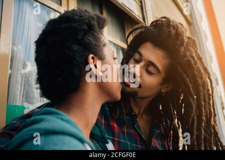 Mixed race couple kissing Stock Photo