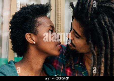 Mixed race couple kissing Stock Photo