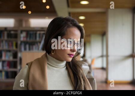 Pretty Woman in glasses reading a book Stock Photo