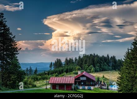 Cumulonimbus over Horska Chata lodge at sunset, White Carpathians, near village of Vyskovec, Zlin Region, Slovacko (Moravian Slovakia), Czech Republic Stock Photo