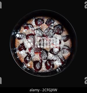 Whole plum pie on black background. Isolated with clipping path. Stock Photo