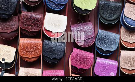 Souvenir market in Yaremche. Women's colored leather shoulder bags embossed with a Carpathian pattern. Bags and accessories on sale. Ukraine, Yaremche Stock Photo