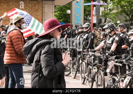 Seattle, USA - May 31, 2020: BLM protestors in Westlake park late in the day. Stock Photo