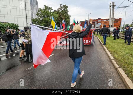 Gdansk, Poland. 5th Sep, 2020. The 'No more brother war' march female participant with a Polish flag in hand is seen in Gdansk, Poland, on 5 September 2020 The march of the far-right, nationalist and racist organizations passed through the streets of the Gdansk city with a strong police escort. March participants chanted nationalist slogans as White Europe, White Life Matters, Scrap the Eu! etc. Credit: Vadim Pacajev/Alamy Live News Stock Photo