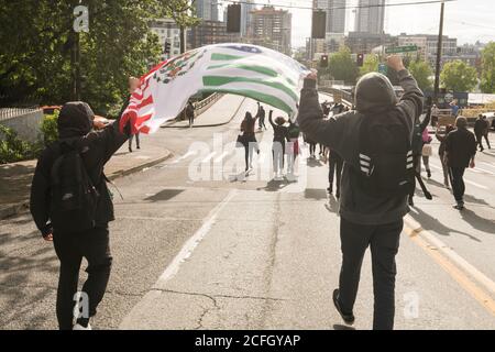Seattle, USA - May 31, 2020: BLM protestors on Capitol Hill late in the day. Stock Photo