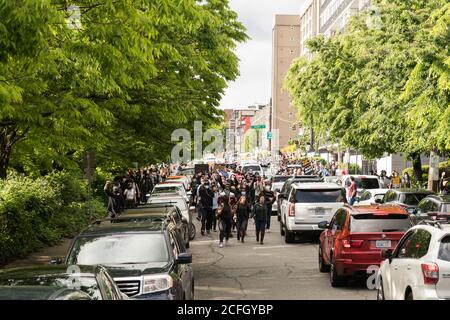 Seattle, USA - May 31, 2020: BLM protestors in Westlake park late in the day. Stock Photo