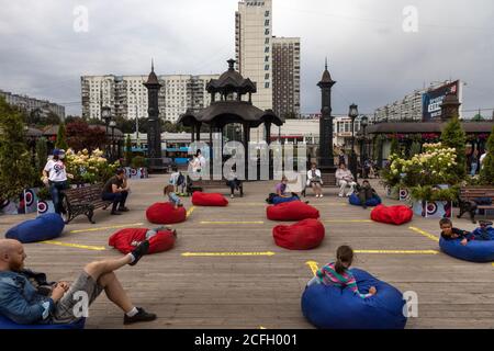 Moscow, Russia. 5th of September, 2020 Moscow, Russia. Chair bags are placed for the audience in front of the stage with the social distancing 1.5 meters during the novel coronavirus COVID-19 pandemic, at the City Day celebration site on Orekhovy Boulevard in Moscow, Russia Stock Photo