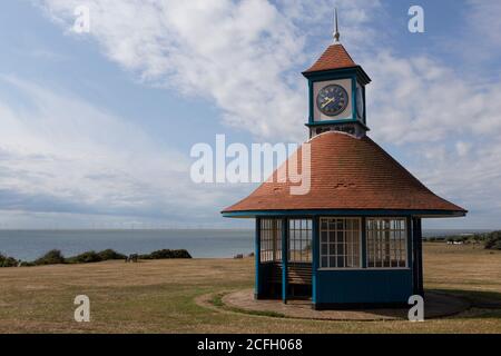 Frinton Clock Tower Shelter, a traditional seaside shelter, at the Greensward in Frinton-on-Sea, Essex. Stock Photo