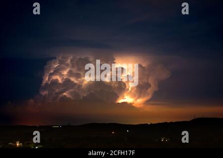 thunderstorm, darkness, stormy dark clouds moving across the sky, slow shutter speed. Stock Photo