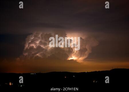 thunderstorm, darkness, stormy dark clouds moving across the sky, slow shutter speed. Stock Photo