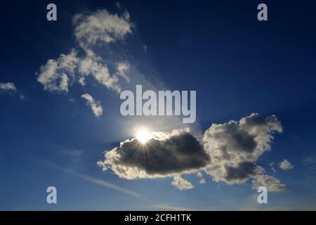 Sunlight behind the cloud on the dramatic moody sky Stock Photo