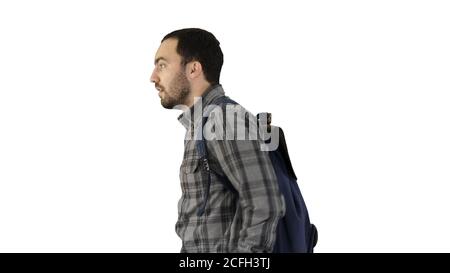 Portrait of man putting backpack on on white background. Stock Photo