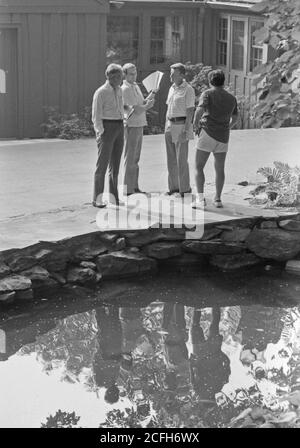 'Cyrus Vance, Jody Powell, Zbigniew Brzezinski and Hamilton Jordan confer at Camp David. ca.  09/12/1978' Stock Photo