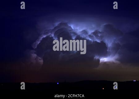 thunderstorm, darkness, stormy dark clouds moving across the sky, slow shutter speed. Stock Photo