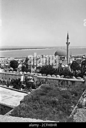 Original Caption:  Along the sea coast. Mosque of Jezzar Pasha  - Location:  ca.  1900 Stock Photo