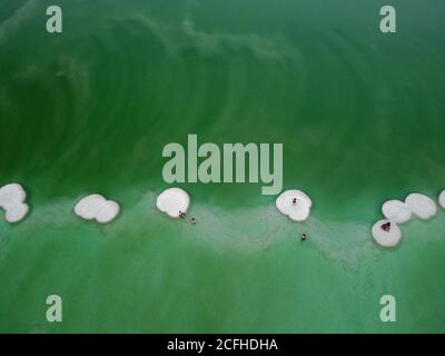 Beijing, China. 4th Sep, 2020. Aerial photo taken on Sept. 4, 2020 shows people standing on salt formations in the Dead Sea near Ein Bokek, Israel. Credit: Muammar Awad/Xinhua/Alamy Live News