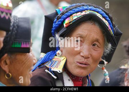 Portrait of a Qiang Tibetan woman in traditional costume, Zhoukeji Village, near Maerkang, Sichuan, China 1st July 2006 Stock Photo