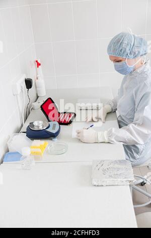 Doctror writes a note in the laboratory Stock Photo