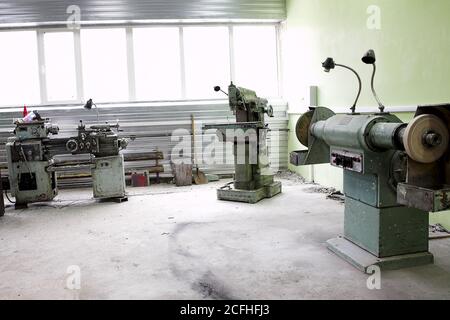 dirty industrial room with big machine tools Stock Photo