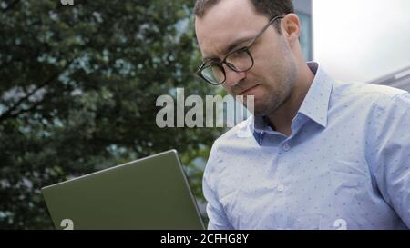 Man with laptop, problems at work, bad news. Stock Photo