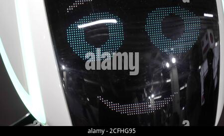 Robot shows bright emotions smiling. Stock Photo