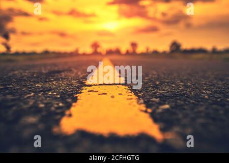Close up traffic line on the ground and sunset. Stock Photo