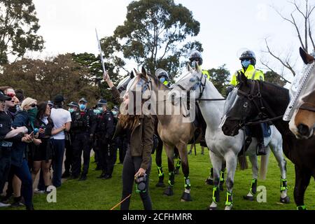 Melbourne, Australia, 5 September, 2020. A woman is seen yelling at police as she holds a placard during the Melbourne Freedom Protest, Phillip Island Circuit, Australia. Credit: Dave Hewison/Alamy Live News Stock Photo