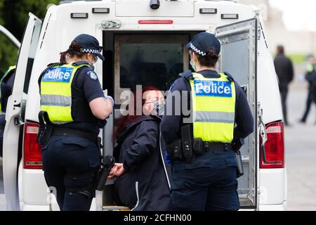 Melbourne, Australia, 5 September, 2020. Police arrest a woman during the Melbourne Freedom Protest, Phillip Island Circuit, Australia. Credit: Dave Hewison/Alamy Live News Stock Photo