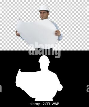 Engineer checking construction plan with what is built, Alpha Channel Stock Photo