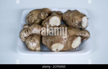 Ginger or Zingiber officinale on white background. Used as a spice and a folk medicine. Stock Photo