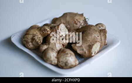 Ginger or Zingiber officinale on white background. Used as a spice and a folk medicine. Stock Photo
