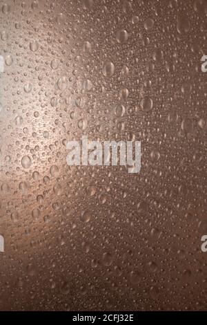 rough plastic surface with synthetic water drops illuminated Stock Photo