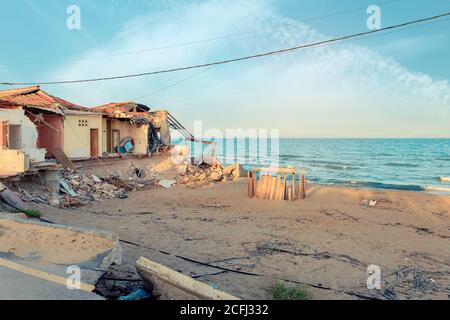 Building destroyed after storm in the beach by climate change Stock Photo