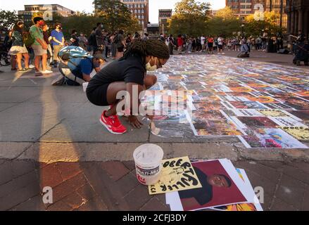 Boston, USA. 05th Sep, 2020. Rally for Black Lives, Black Voices & Jacob Blake.  Boston, MA, USA. Copley Square.  More than 500 gathered in Copley Square, in front of Trinity Church in central Boston on Sept. 5th  2020 in support of Black Lives Matter. Photo shows a student gluing Printouts of Black men and women killed by police pasted on the ground in Copley Square in front of Trinity Church. Credit: Chuck Nacke / Alamy Live News Stock Photo