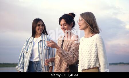 Woman using a smartphone voice recognition function online while Stock Photo