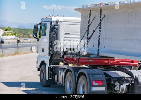 Special transport with a beam Truck with a specific platform carrying a large beam. Stock Photo