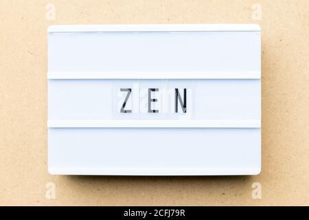 White lightbox with word zen on wood background Stock Photo