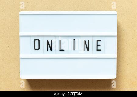 Lightbox with word online on wood background Stock Photo