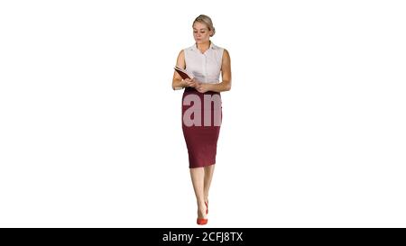 Successful businesswoman or entrepreneur taking a look in her notes on white background. Stock Photo