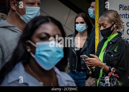 London, UK. 6th September 2020. Coronavirus: Sunday shoppers with face coverings seen near Oxford Street station exit. Credit: Guy Corbishley/Alamy Live News