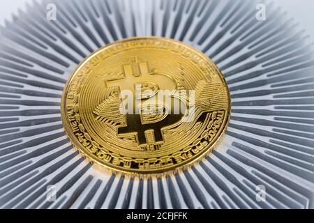Bitcoin shiner close-up on aluminium heatsink with selective focus Stock Photo