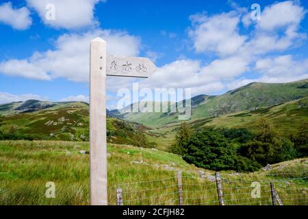 wooden public bridleway sign post on Kirkstone Pass in The Lake District Stock Photo