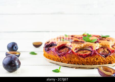 Delicious homemade plum pie on white background Stock Photo