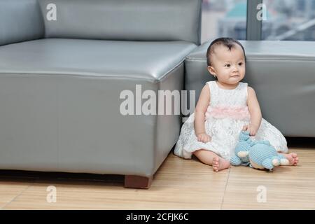 Girl playing with toy Stock Photo