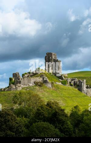 Corfe Castle, Dorset, UK.  6th September 2020.  UK Weather.  View from West Hill of the ruins of Corfe Castle in Dorset as dark threatening clouds build on a day of warm sunny spells.  Picture Credit: Graham Hunt/Alamy Live News Stock Photo