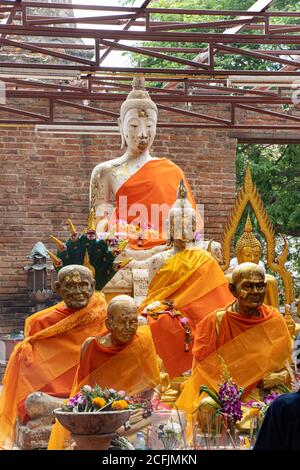 AYUTTHAYA, THAILAND, JUN 03 2020, A statue of Buddha with The figures of the Buddhist monks at Buddhist temple Wat Khun Inthapramun, Thailand. Stock Photo