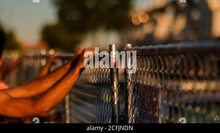 Louisville, United States. 05th Sep, 2020. A protester shakes a fence while protesting outside Churchill Downs on Kentucky Derby Day during the Breonna Taylor protests.Anti-racism protesters marched around the perimeter of Churchill Downs on Kentucky Derby Day demanding justice for Breonna Taylor who was killed by the Louisville Metro Police over 100 days ago and no arrests have been made following her death. Credit: SOPA Images Limited/Alamy Live News Stock Photo