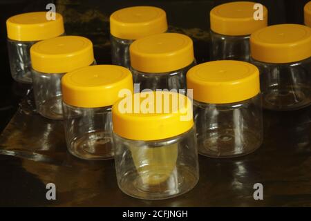 Empty jars ready for filling on a black background Stock Photo