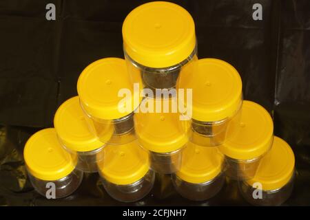 Empty jars ready for filling on a black background Stock Photo