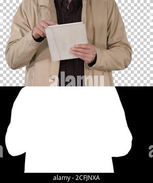 Hands of man using tablet, Alpha Channel Stock Photo